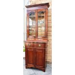 AN EDWARDIAN MAHOGANY BOOKCASE CABINET the upper section with lead glazed doors enclosing three