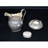 ASSORTED MIDDLE EASTERN SILVER To include an engraved jug, pill box and cigarette dish. Arabic