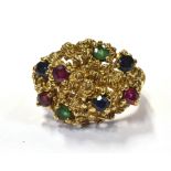 MULTI GEM SET 9CT GOLD RING Textured bombe style head set with 3.0mm round mixed cut sapphires,