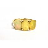 FIRE OPAL & 9CT GOLD THREE STONE RING Oval mixed cut, bright fire opals, approx 8.1 x 6.1mm on a