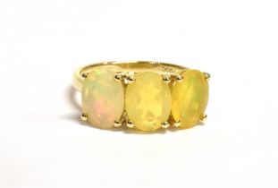 FIRE OPAL & 9CT GOLD THREE STONE RING Oval mixed cut, bright fire opals, approx 8.1 x 6.1mm on a