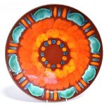 A LARGE POOLE POTTERY VOLCANO PATTERN CHARGER The charger measures 42cm in diameter and is in good