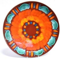 A LARGE POOLE POTTERY VOLCANO PATTERN CHARGER The charger measures 42cm in diameter and is in good