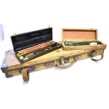 A CANVAS BRASS MOUNTED GUN CASE with deep red baize lining by 'William Evans, London' 78 x 23cm,