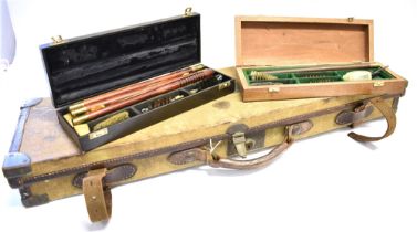 A CANVAS BRASS MOUNTED GUN CASE with deep red baize lining by 'William Evans, London' 78 x 23cm,