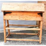 A PINE SADDLE HORSE the hinged top opening to reveal a work surface supported by four hinged