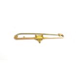 9CT GOLD, RECTANGULAR BAR 4.5cm long x 1.2mm, with centrally applied fox mask, on a steel pin with