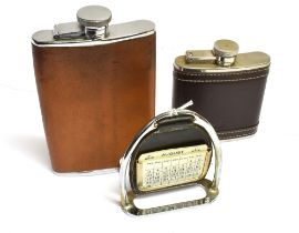 TWO CURVED LEATHER COVERED HIP FLASKS 5oz & 8oz and a stirrup calendar