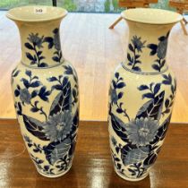 BLUE AND WHITE TALL VASES WITH FLORAL DECORATION