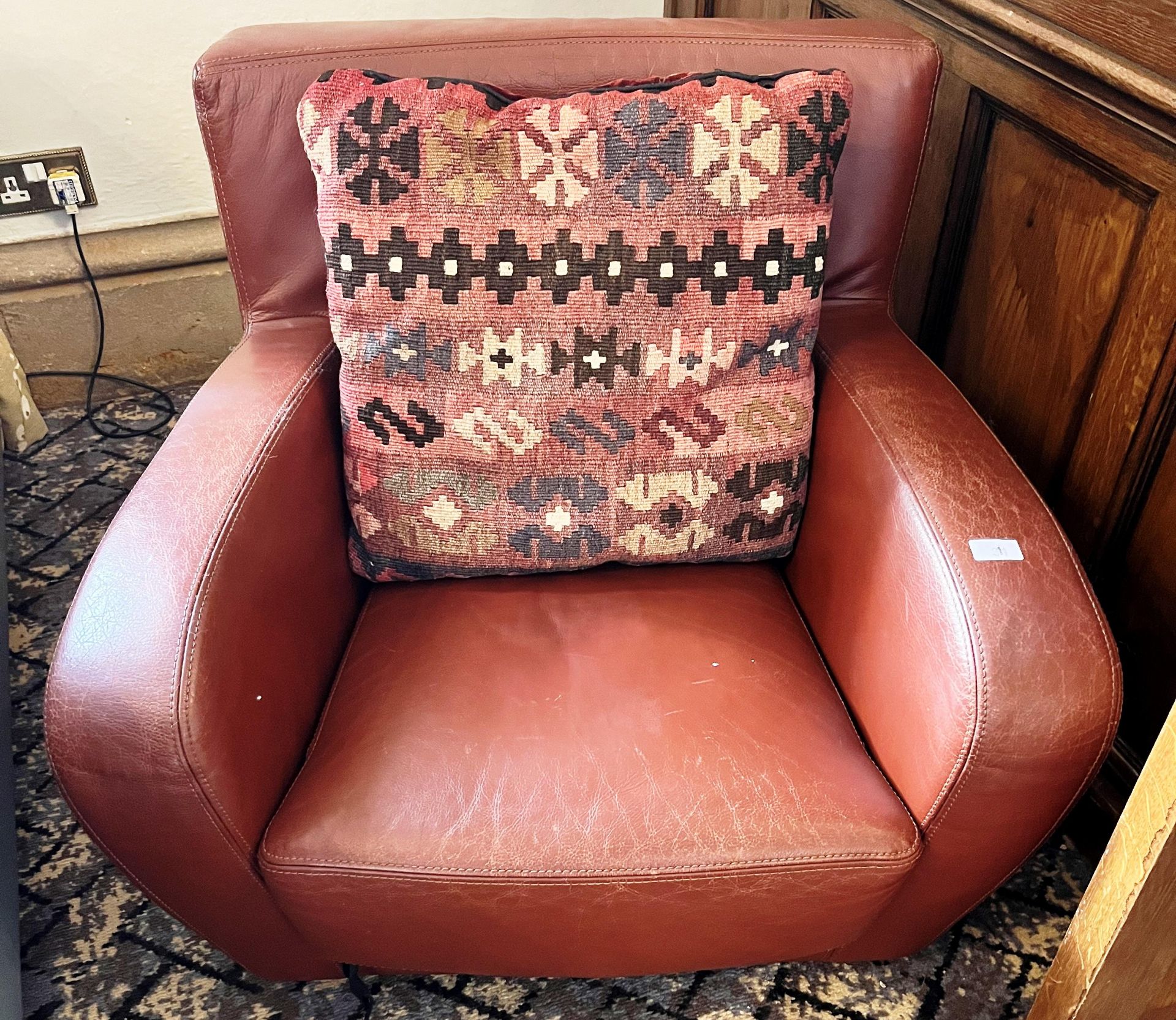 BROWN LEATHER ARMCHAIR AND CUSHION