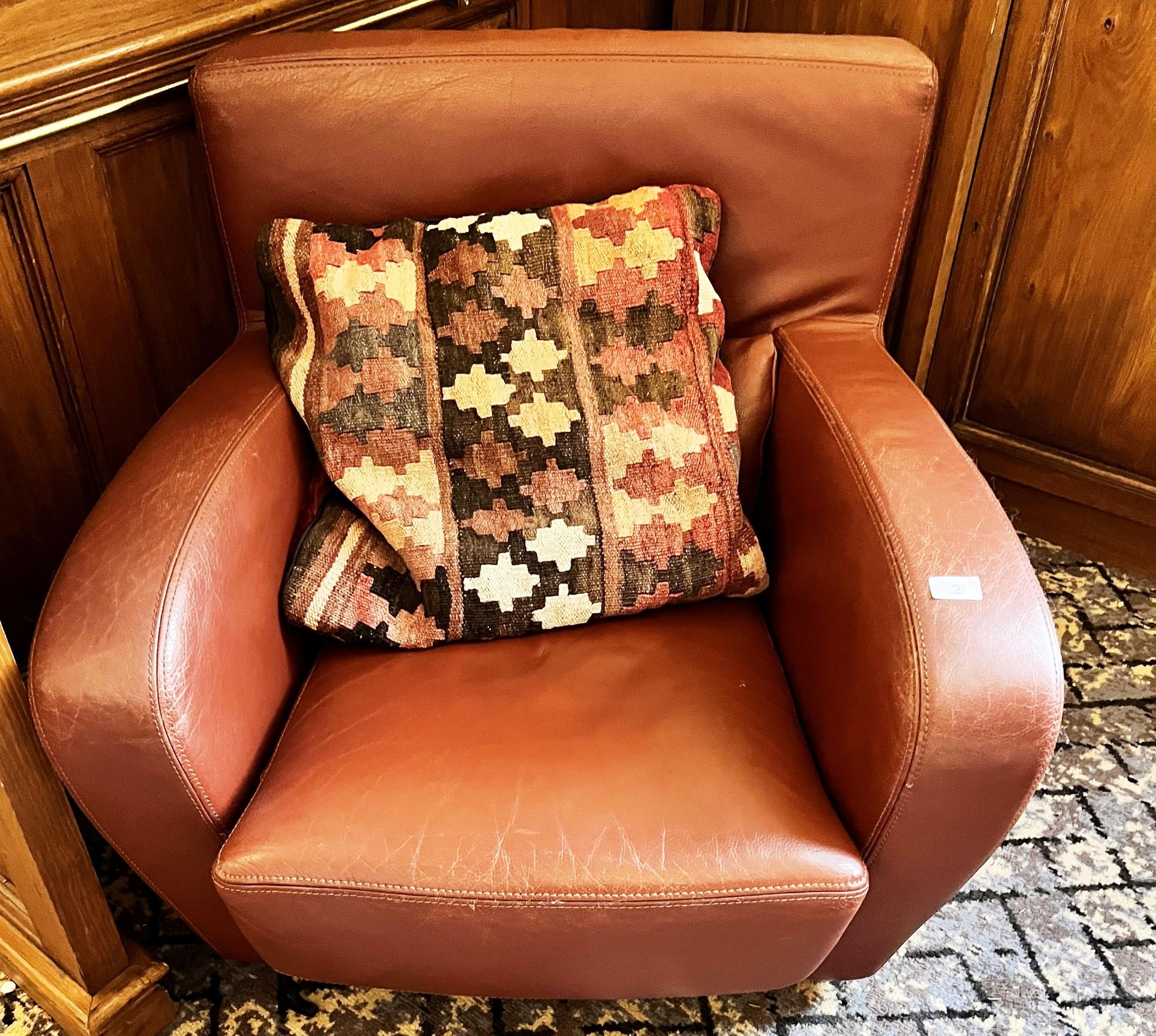 BROWN LEATHER ARMCHAIR AND CUSHION