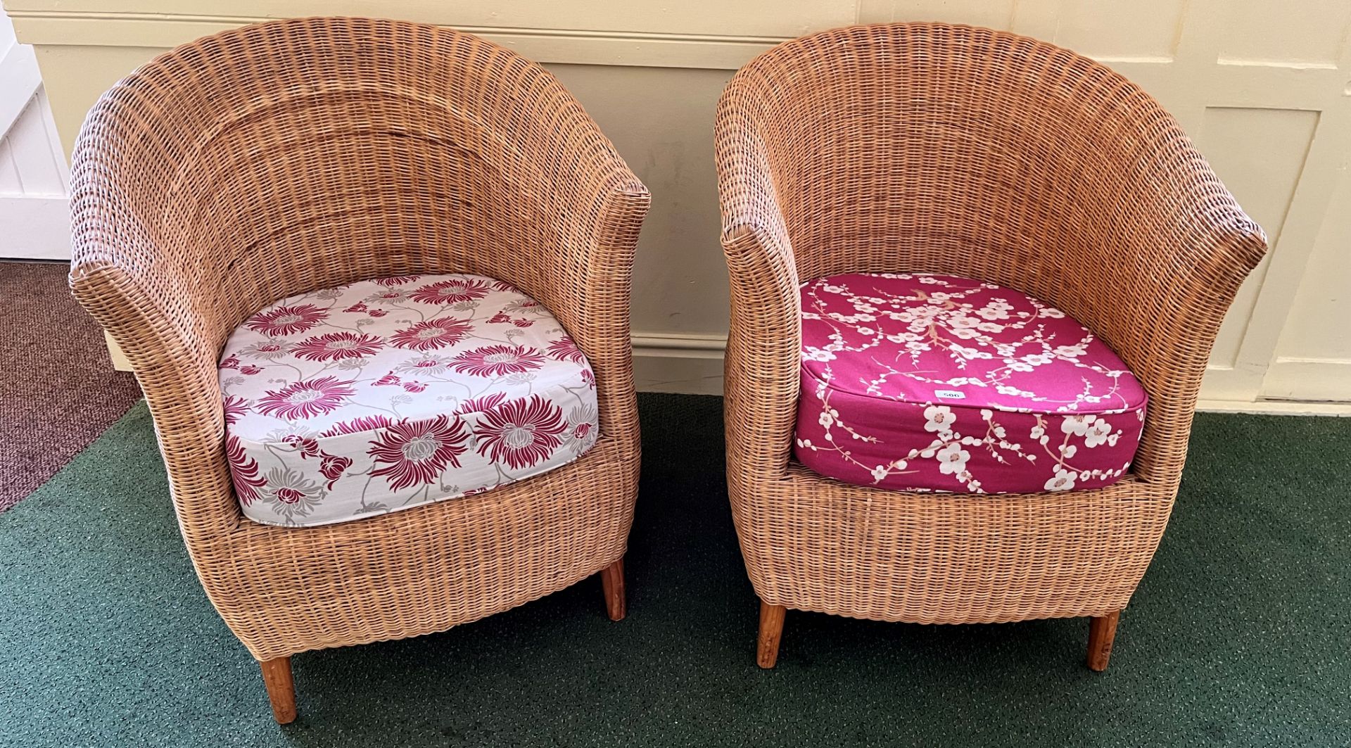 TWO RATTAN STYLE ARMCHAIRS