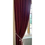 A PAIR OF RED LINED CURTAINS