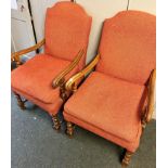 TWO ARMCHAIRS WITH ORANGE COVERS