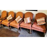 EIGHT OAK ARMCHAIRS WITH ORANGE COVERS