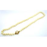 CULTURED WHITE PEARL NECKLACE 45cm long, comprising 6.5-6.8mm round/ semi-round pearls, with very