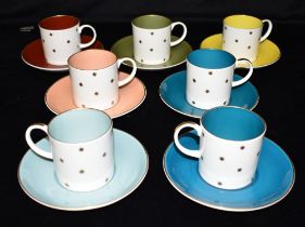 SEVEN SUSIE COOPER BONE CHINA GOLD 'STARBURST' PATTERN HARLEQUIN CUPS & SAUCERS each cup 6.25cm