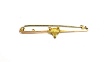 9CT GOLD, RECTANGULAR BAR 4.5cm long x 1.2mm, with centrally applied fox mask, on a steel pin with