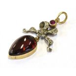 ANTIQUE FRENCH GEM SET PENDANT Featuring a pear shaped, cabochon pyrope garnet, approx 14.8 x 9.2mm,