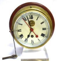 A COOKE OF HULL SHIP'S BRASS CASED BULKHEAD CLOCK the 14.5cm (5 3/4 inch) diameter cream dial with