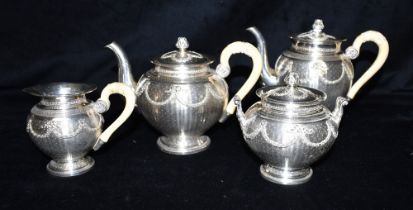 BELLE EPOQUE FRENCH SILVER TEA SERVICE Of baluster form, decorated with engine turning and