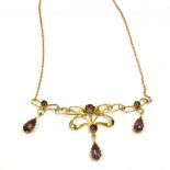 ART NOUVEAU AMETHYST 15CT GOLD LAVALIER 46cm long, with an Art Nouveau centrepiece of fluid gold