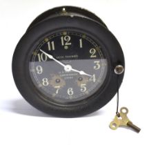 A SETH THOMAS SHIP'S BULKHEAD CLOCK the 14cm (5 1/2 inch) diameter black dial with white Arabic