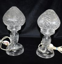 A PAIR OF CUT CRYSTAL LAMPS Standing approx 35cm tall, a pair of cut crystal lamp stands and shades,