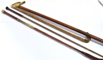 TWO RIDING CROPS with antler grips and another and a riding whip (4)