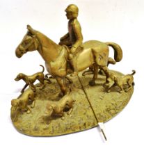 A HEAVY BRASS GROUP of a mounted huntsman with six hounds, on an oval base, 42cm x 27cm, height