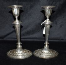 VICTORIAN SILVER CANDLESTICKS A PAIR Standing 24cm tall, of oval form on fluted bases, columns and