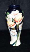A MOORCROFT POTTERY VASE OF BALUSTER FORM decorated in the 'Minuet' pattern, with impressed and
