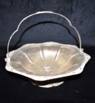 GEORGE IV SILVER SWING HANDLED DISH 30.3cm diameter, of fluted floral shape with floral and