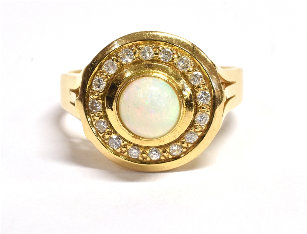 OPAL & DIAMOND DRESS RING Central bezel set white opal round cabochon, estimated 0.31 carats,