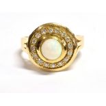 OPAL & DIAMOND DRESS RING Central bezel set white opal round cabochon, estimated 0.31 carats,