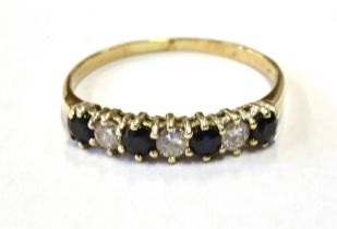 SAPPHIRE & DIAMOND HALF ETERNITY 9ct gold (tested) with dark blue sapphires estimated to total 0.