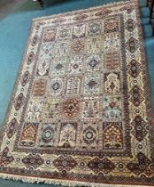 A SUMAK CARPET with a buff ground, 345cm x 247cm.