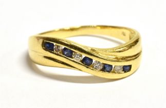 18CT DIAMOND & SAPPHIRE ETERNITY RING A channel set head with alternating round mid blue