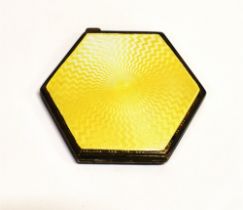 STERLING SILVER & ENAMEL COMPACT A hexagonal silver compact with primrose yellow guilloche enamel