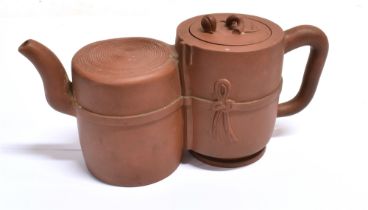 A CHINESE YIXING DOUBLE-CHAMBER TEAPOT & COVER with a ribbon-tied band, the cover with a bud and