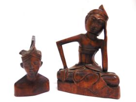 ETHNOGRAPHICA - TWO INDONESIAN CARVED FIGURES comprising one seated male, 21cm high; and one male