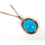 TURQUOISE PENDANT ON CARTIER CHAIN A natural, intense sky blue turquoise oval cabochon, approx 16.