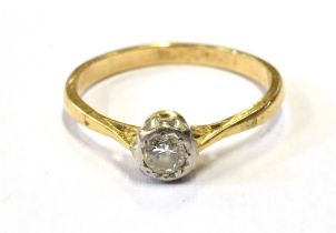 18CT GOLD & DIAMOND SOLITAIRE A platinum illusion set round brilliant cut diamond, estimated 0.20