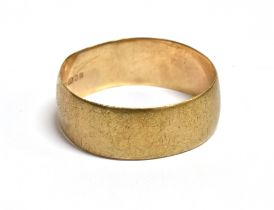 9CT GOLD PLAIN WEDDING BAND 7.3mm wide, ring size V, hallmarked 375 London 1988. Weight 3.1 grams.