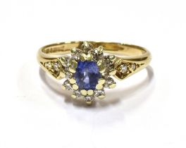 9CT GOLD CEYLON SAPPHIRE & DIAMOND RING An oval cut Ceylonese, cornflower blue sapphire, estimated
