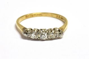 18CT GOLD & ESTATE DIAMOND FIVE STONE Five platinum coronet claw settings containting estate cut