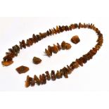 ANTIQUE BALTIC AMBER NECKLACE Approx 72cm long, (broken) comprising polished pieces of raw amber,