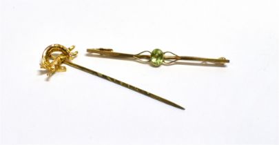 9CT GOLD ANTIQUE BROOCHES One approx 5.0cm long with an oval collet set peridot on square profile