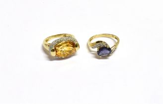 9CT GEM & DIAMOND SET RINGS One with oval claw set tanzanite, estimated 1.74 carats, flanked by