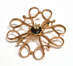 9CT ROSE GOLD & DIAMOND BROOCH 25.6mm diameter, ribbon scroll work brooch with central claw set